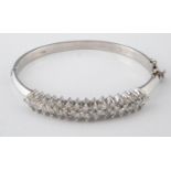 A 14ct white gold and diamond bangle, approx. 5.7ct