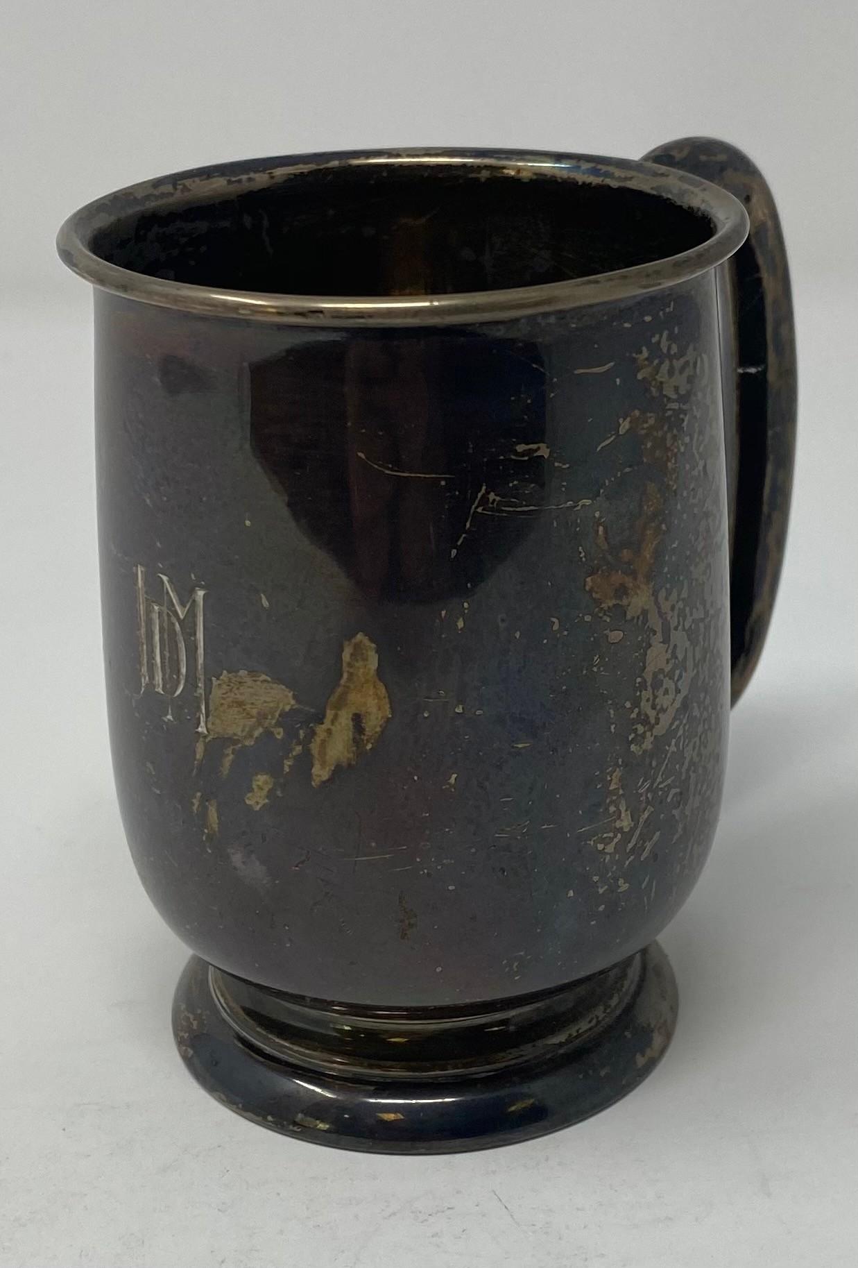 A silver mug, initialled, Sheffield 1936, 6.3 ozt, 9.5 cm high