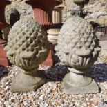 A pair of composite stone garden finials, in the form of pineapples, various loss to bases (2)
