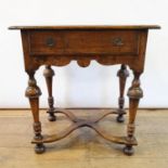 An 18th century style oak side table, with a frieze drawer, on turned tapering legs united by an X