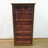 An oak glazed bookcase, 140 cm high, 67 cm wide