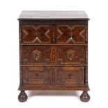 A 17th century style oak chest of three drawers, on bun feet, 72 cm wide