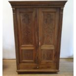 A Continental walnut armoire, having two doors, above a single drawer, 185 cm high x 126 cm wide