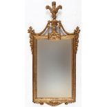 A 20th century carved giltwood wall mirror, with an urn finial, 123 x 61 cm