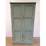 A painted pine cupboard, having four doors, on a plinth base, 208 cm high x 109 cm wide