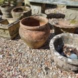 A composite stone garden planter, decorated festoons, 39 cm diameter, and five others (6)