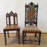 A 19th century oak gothic style hall chair, another hall chair (2)