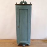 A painted bowfront freestanding corner cupboard, with a single door, 170 cm high x 56 cm wide