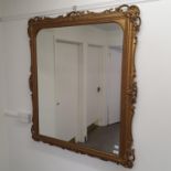 A gilt gesso wall mirror, 104 x 115 cm