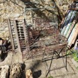 A wirework plant stand, 100 cm wide, a metal folding shelf, a folding table, and two feeders (5)