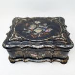 A 19th century papier-mâché serpentine sewing box, inlaid with mother of pearl, decorated flowers,