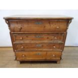 A 19th Century continental pine serpentine top commode, having three drawers, 95 cm wide