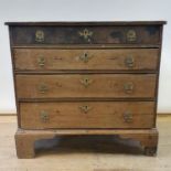 A 19th century oak chest of four drawers, on bracket feet, 50 cm wide Replaced back, loss of front