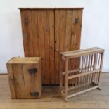 A pine cupboard, 91 cm wide, a pine plate rack, 69 cm wide, and a pine wall hanging cupboard, with