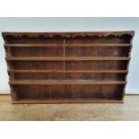 A 19th century elm wall hanging plate rack, 127 cm wide Various repairs and alterations