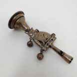 A 19th century silver coloured metal baby's rattle, in the form of a cat, 10 cm Various losses,