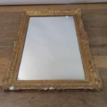 A gilt gesso wall mirror, 92 x 65 cm Various losses to frame