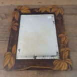 A wall mirror, with penwork decoration, 58 x 45 cm Lacking back, the mirror very pitted, see images