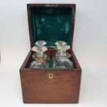 A 19th century mahogany and brass bound decanter box, with a hinge lid to reveal four cut glass