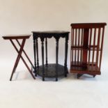 A mahogany revolving bookcase, 40 cm wide, a folding chess top table and an ebonised table (3)