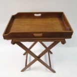 A mahogany tray on stand, with Harrod's retail label, 66 cm wide