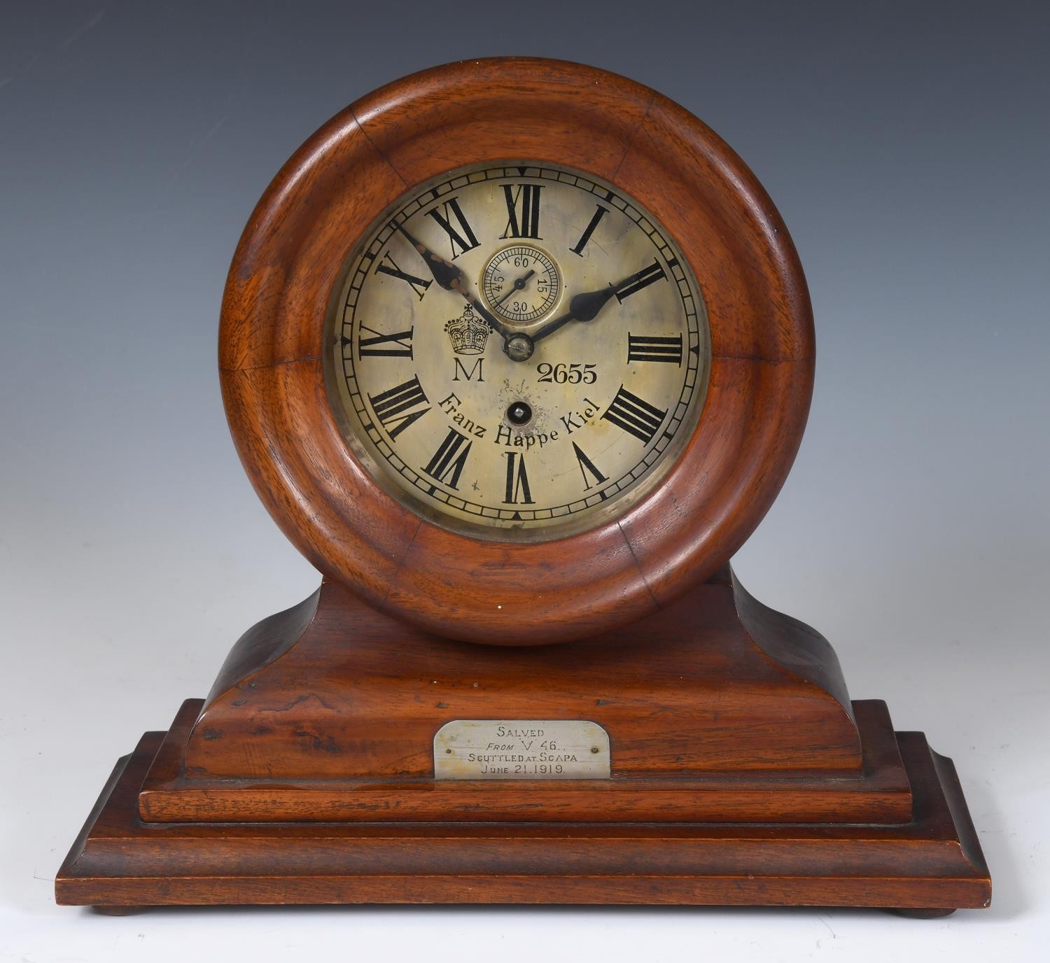 An Imperial German Navy bulkhead type clock, the 15 cm diameter silvered dial signed Franz Happe