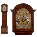 A longcase clock, the 31 cm arched square brass dial signed Maple, London, Made in England, to a