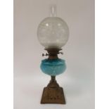 An oil lamp, with a blue glass well, two silver tea spoons and various other items (box) cannot