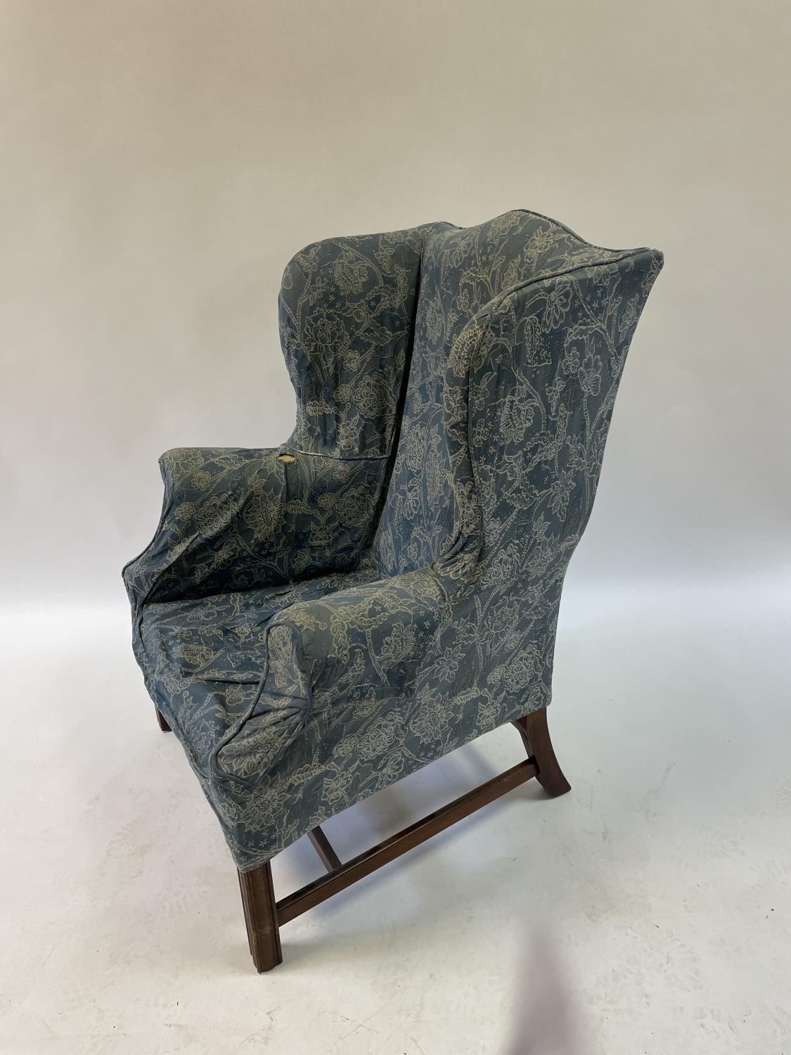 A 19th century style wing back armchair