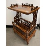 A 19th century walnut Canterbury, with raised top, base having a single drawer, on turned feet, 61