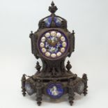 A late 19th century Continental mantel clock, the 8.5 cm diameter enamel dial with Roman numerals