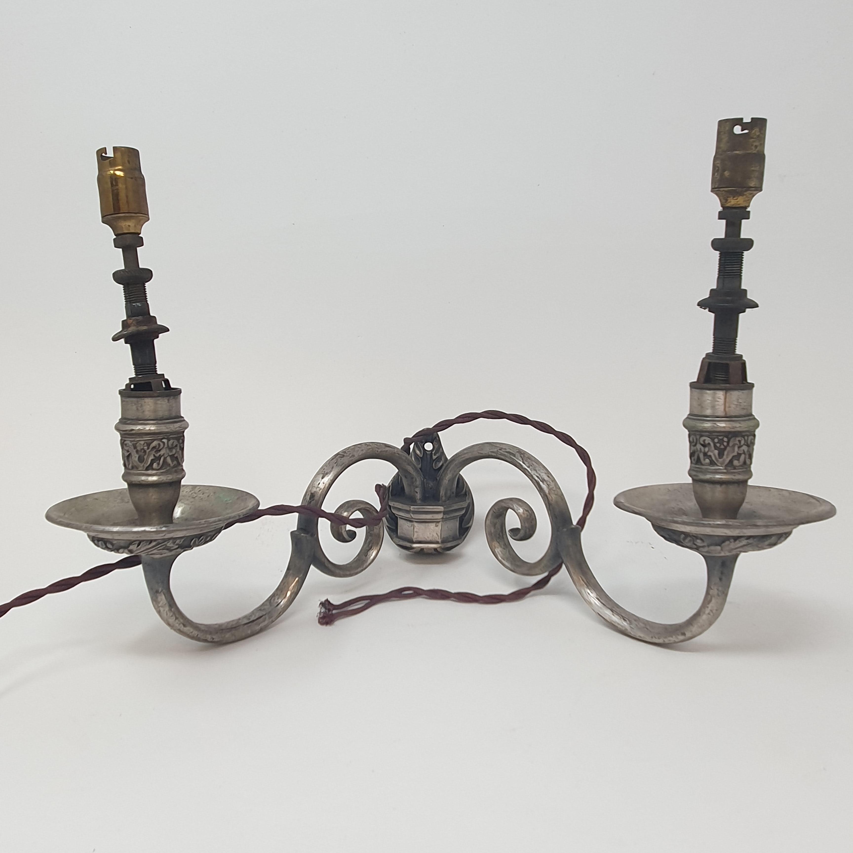 Seven silver plated two branch wall lights (box)