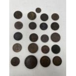 A small group of tokens, pennies and other copper coins