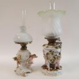 A oil lamp, with Dresden porcelain base, decorated flowers and cherubs, 54 cm high, and another,