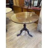 A George III mahogany tripod table, on a baluster turned column, 92 cm wide