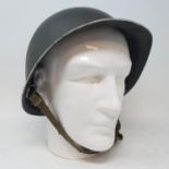 An American military helmet, on a head stand