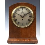 A WWII MOD issue clock, the 18 cm diameter silvered dial with RAF insignia, fitted an eight day