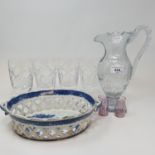 A 19th century cut glass jug, 26 cm high, a set of four Waterford cut glass tumblers, a blue and