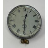 A dashboard style timepiece, the 7.5 cm diameter silvered dial with Roman numerals, signed Jaeger,