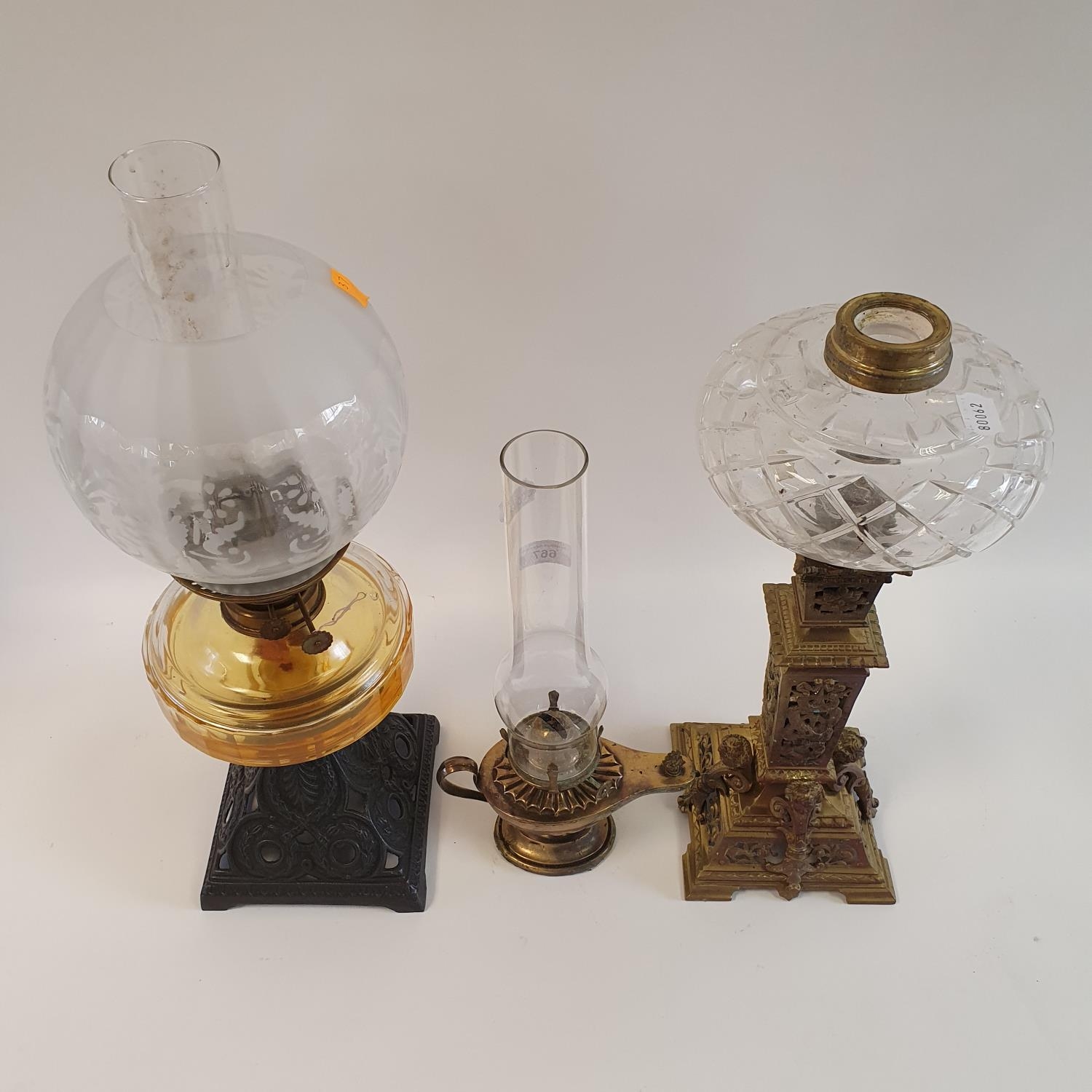 An oil lamp, with a clear glass well, 56 cm, an oil lamp in the form of a genie's lamp, 39 cm - Image 2 of 3