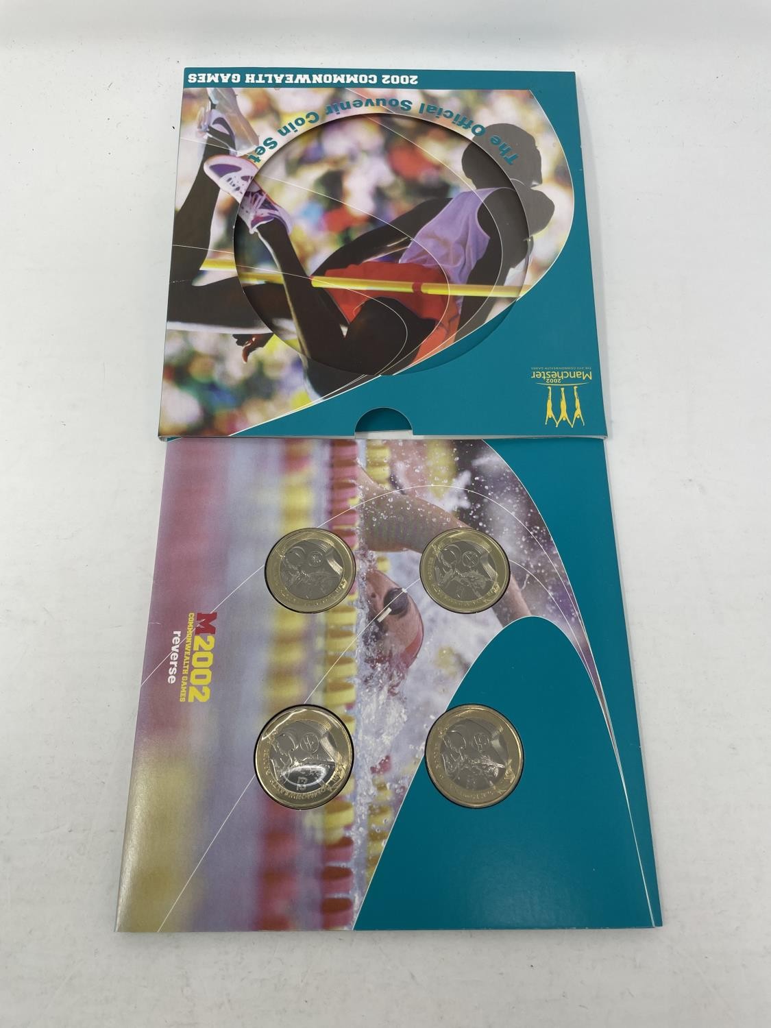 A Commonwealth Games coin set, 2002, and other similar coins