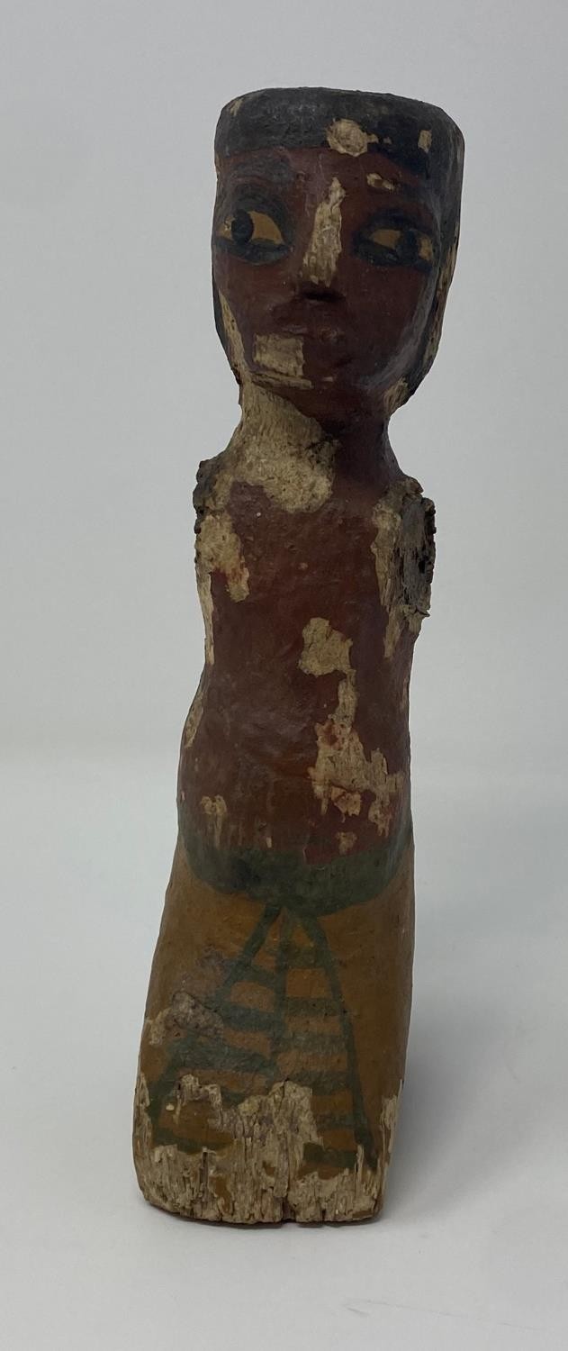 An Egyptian style wooden boatman figure, with painted decoration to face and body 50 cm Purchased