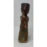 An Egyptian style wooden boatman figure, with painted decoration to face and body 50 cm Purchased