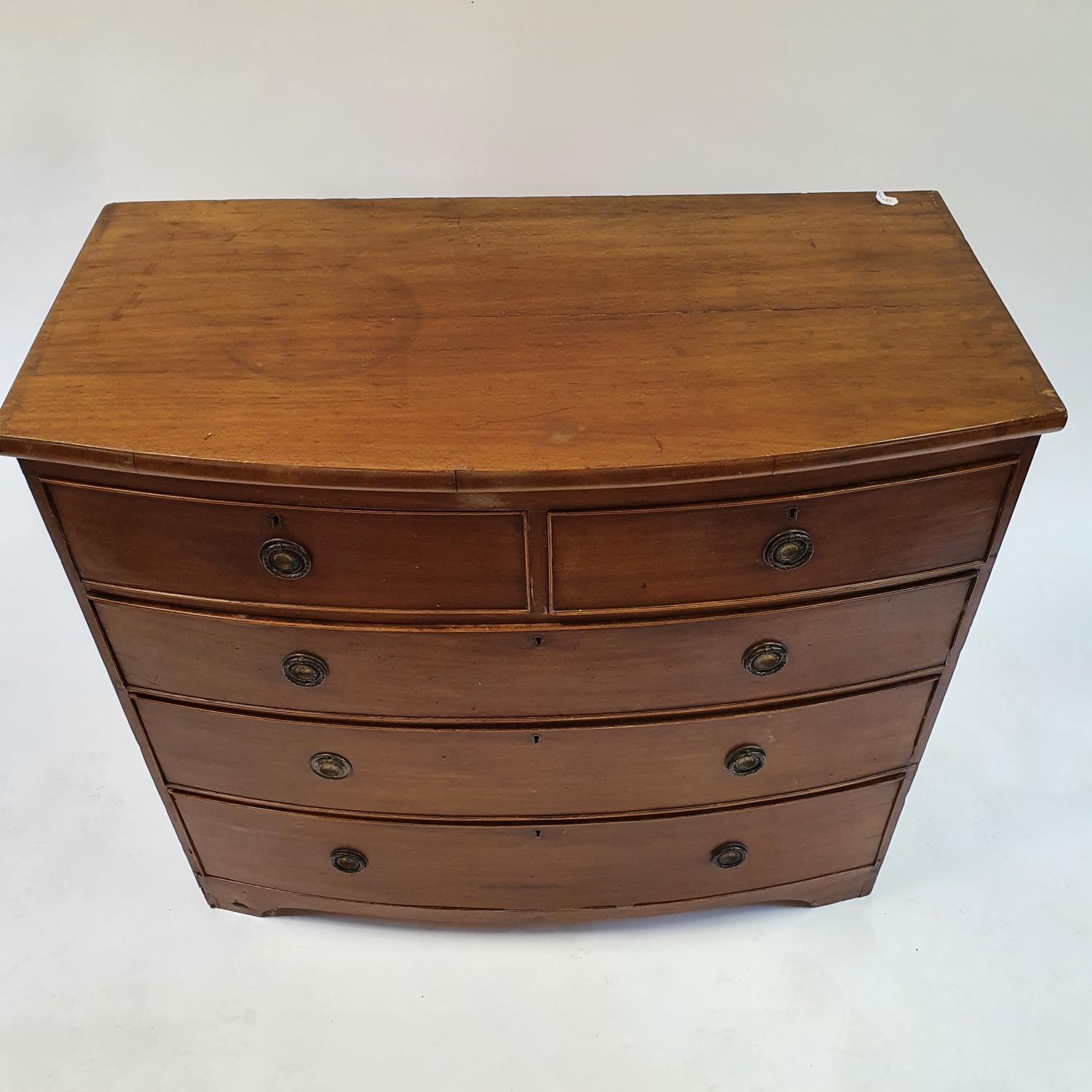 A 19th century mahogany bow front chest, having two short and three long drawers, 100 cm wide - Image 2 of 3
