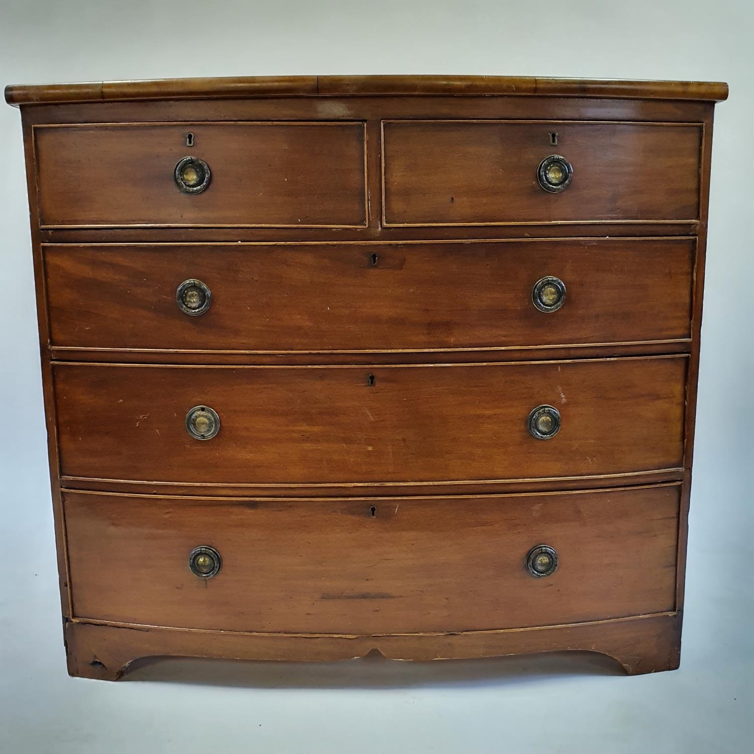 A 19th century mahogany bow front chest, having two short and three long drawers, 100 cm wide