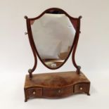 A 19th century mahogany dressing mirror, the serpentine base with three drawers, 47 cm wide