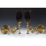A pair of late 19th/early 20th century brass gas lamps, in the form of mermaids holding torches,