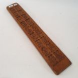 A treen gingerbread mould, 70 cm wide