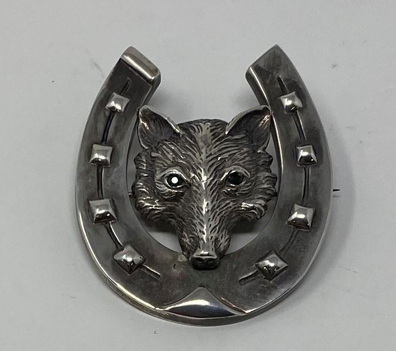 A silver fox head and horseshoe hunting brooch This is a modern copy