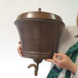 An unusual late 19th century copper cistern and cover, engraved a coronet above an armorial 41 cm